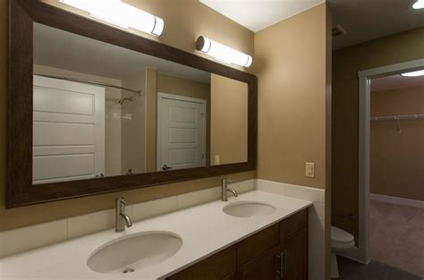 I added shelves and some trim to another amazing bathroom mirror transformation! Mirror Trim, Bath Lights, & Furr-out between Toilet ...