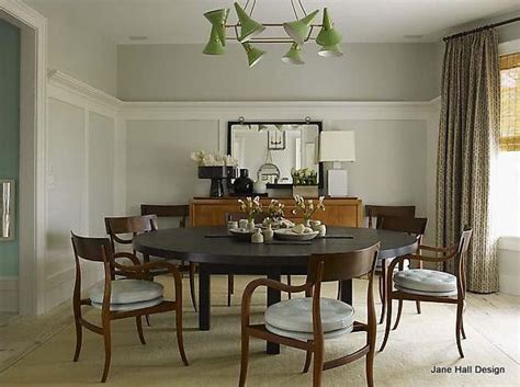 A Dining Room Table With Six Chairs Around It