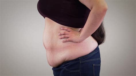 Close Up Of Fat Unrecognizable Caucasian Woman Retracting Belly And