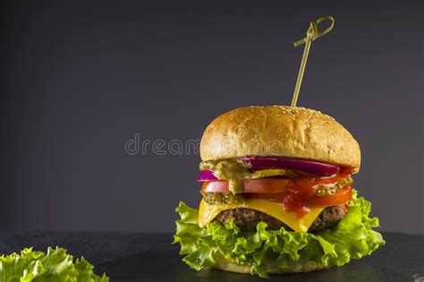 Delicious Fast Food Fresh Juicy Burger On A Black Background Stock