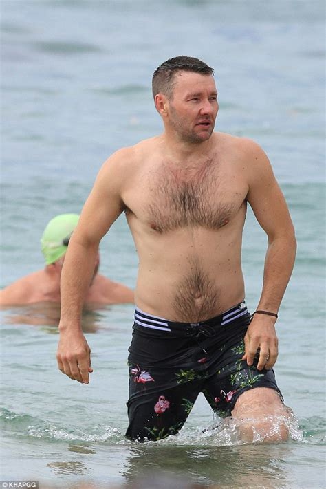 Joel Edgerton Strips Down Into His Swimming Trunks Exposing His Bare