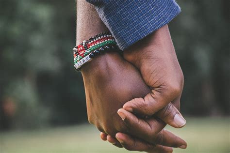 close-Up Photo of Two Person's Holding Hands · Free Stock Photo
