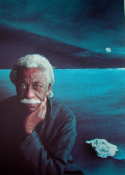 An Old Man With A Moustache Sitting In Front Of The Ocean