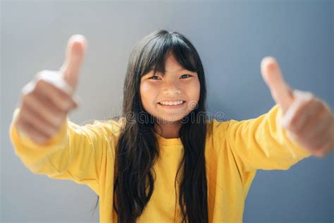 Children Happy Smiling With Hand Thumbs Up And Sunshine Background