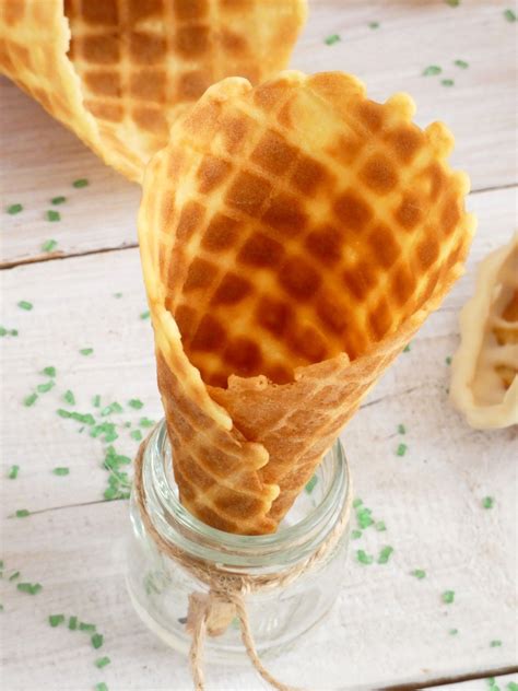 Two Waffle Cones Are In A Glass Jar