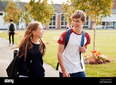 Teenage Students Walking Around College Campus Together Stock Photo Alamy