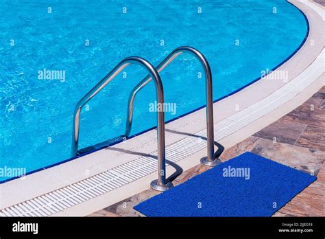 Side Of A Swimming Pool With Chrome Stairs Stock Photo Alamy