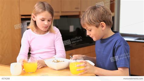Happy Children Eating Their Breakfast Stock Video Footage 4574288