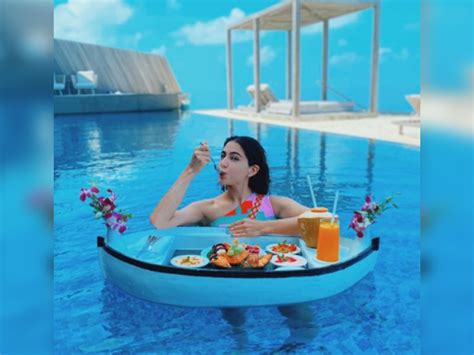 Sara Ali Khan Stuns In Multi Coloured Bikini Enjoys Floating Breakfast