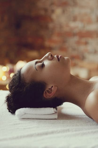Free Photo African American Woman Receiving A Relaxing Massage At The Spa