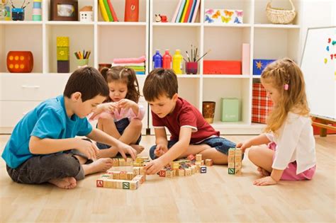 Children Playing With Blocks On The Floor Untumble Party Supplies Blog