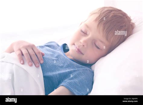 Adorable Little Boy Sleeping In Bed Stock Photo Alamy
