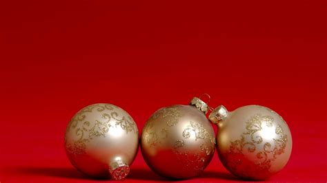 Beautiful Three Christmas Balls With Red Background Free