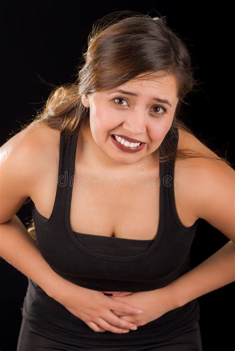 Close Up Of A Beautiful Young Woman With Stomach Ache Or Nausea In A