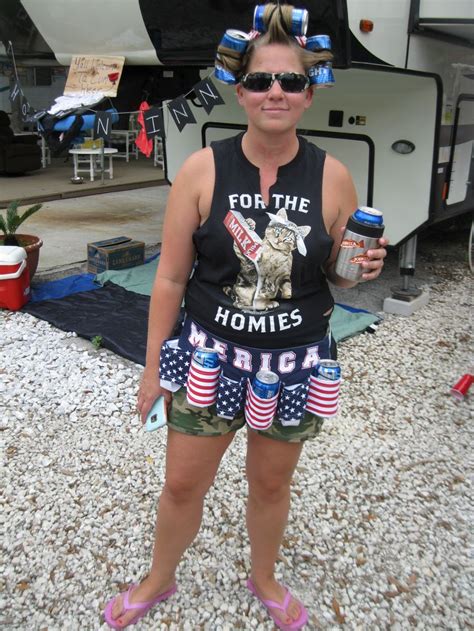 A Woman Wearing Patriotic Shorts And Sunglasses Holding Two Cans Of