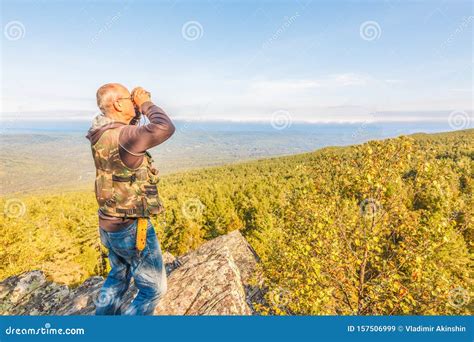 A Tourist Stands On Top Of A Mountain Stock Image Image Of Device