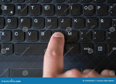 Top View Of A Finger Pressing The N Key On A Laptop Keyboard Stock