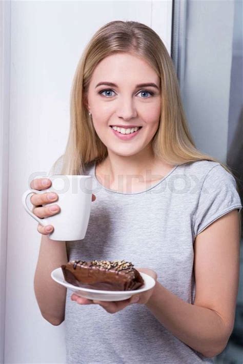 Happy Woman With Chocolate Cake And Cup Of Coffee Or Tea Stock Photo