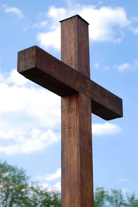 A Wooden Cross With The Words Dear Gods Mum On It And Clouds In The