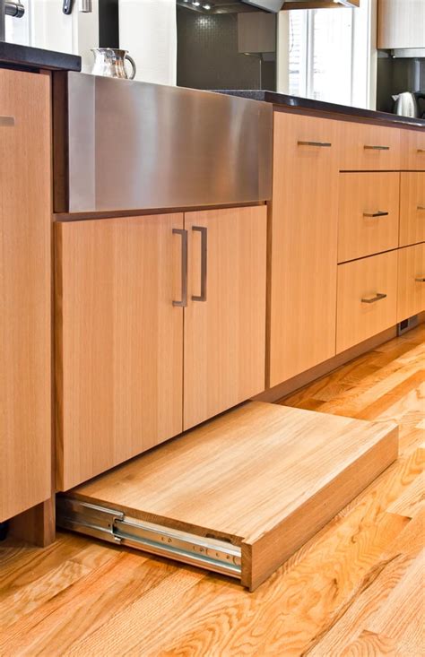 This photo shows the former dark cabinets, which the homeowners felt made the kitchen look dreary. Contemporary kitchen cabinets built using rift cut white ...