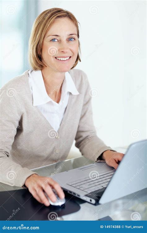 Happy Businesswoman Using Laptop At Her Desk Stock Photo Image Of