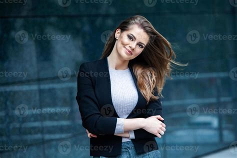 confident business expert happy successful professional posing near office building european