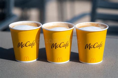 Mccafe Three Yellow Cups Of Cappuccino Coffee In Mcdonalds Restaurant 2303 Editorial Image