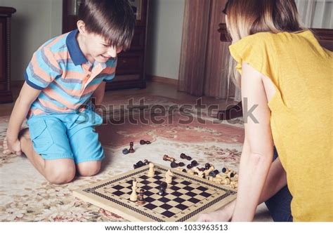 Smiling Boy Playing Chess His Mom Stock Photo 1033963513 Shutterstock