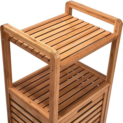 Schrank mit sehr aufwändigem dekor aus schnitzereien und leisten, effektvoll kombiniert mit ornamentbeschlägen und von hand aufgetragenen farbeffekten. BUTLERS BIG BAMBOO Bad Regal mit Wäschekorb aus Bambus ...