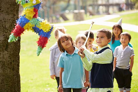 Royalty Free Kid Hitting Pinata Pictures Images And Stock Photos Istock