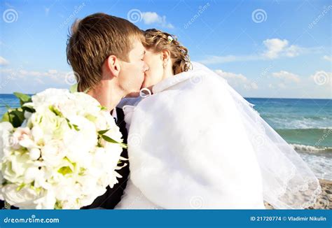 Newly Married Couple Kissing On The Beach Stock Images Image 21720774