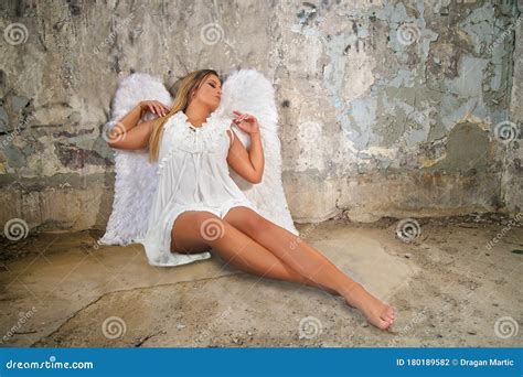 Portrait Of Beautiful Woman With White Angel Wings On Stock Photo