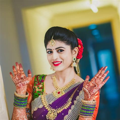 south indian bride diamond indian bridal jewelry temple jewelry jhumkis purple silk