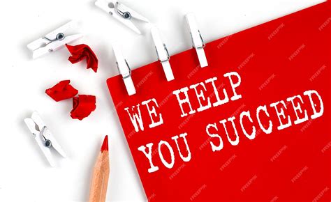 Premium Photo We Help You Succeed Text On The Red Paper With Office