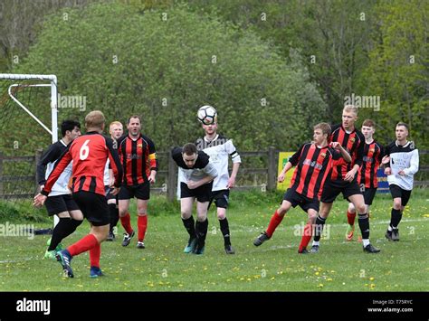 Football Action In The Hope Valley Amateur League Match Between Buxworth Reserves Redblack
