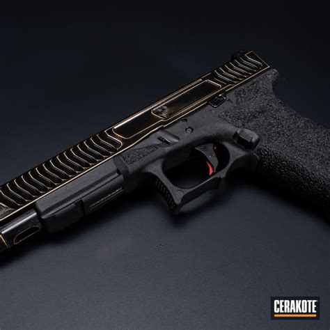 Distressed Glock 17l Cerakoted Using Graphite Black And Gold Cerakote