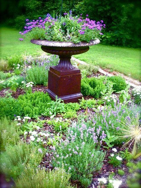 Herb garden design is perhaps, one of the most delightful activities for the gardener. Simple herb garden with an urn as center piece - b ...