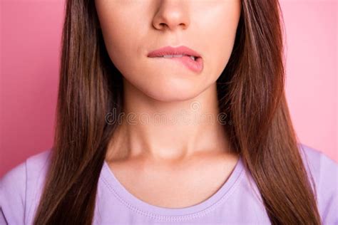 Close Up Photo Portrait Of Woman Biting Lower Lip Isolated On Pastel Pink Colored Background
