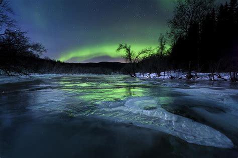 Aurora Borealis Over A Frozen Kvannelva Photograph By Arild Heitmann