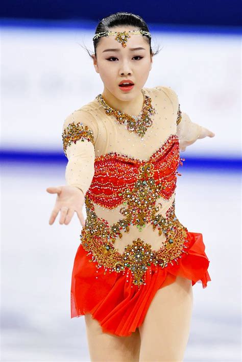 A Female Figure Skating On The Ice