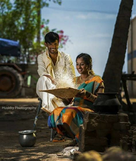 A Man And Woman Sitting On The Ground Near Each Other With Rice In Their Hands