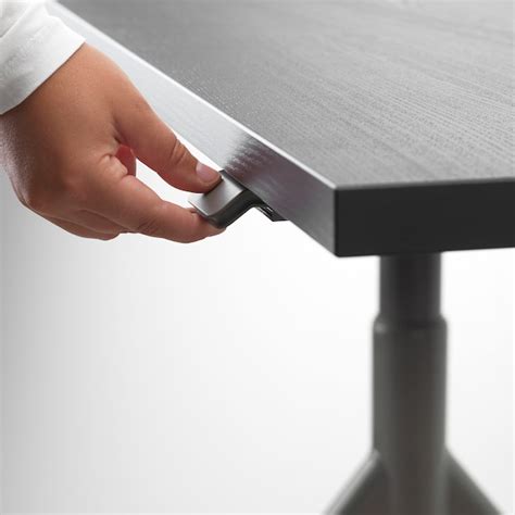 Then a sitting and standing desk might be something for you. IDÅSEN Desk sit/stand, black, dark grey, 120x70 cm - IKEA