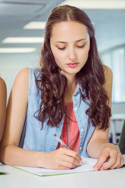 Premium Photo Student Taking Notes In Class