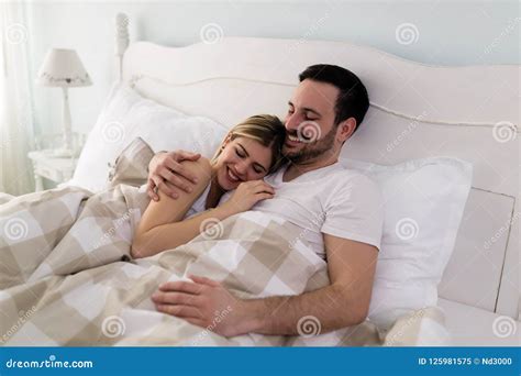 Young Attractive Couple Having Romantic Time In Bed Stock Image Image