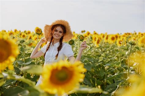 Premium Photo Beautiful Sweet Girl In A Hat On A Field Of Sunflowers