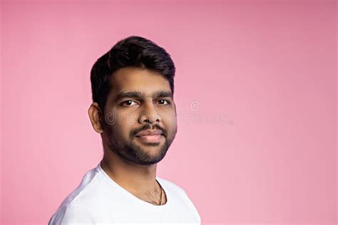 Portrait Of Handsome Indian Guy Standing On Pink Background Stock Image