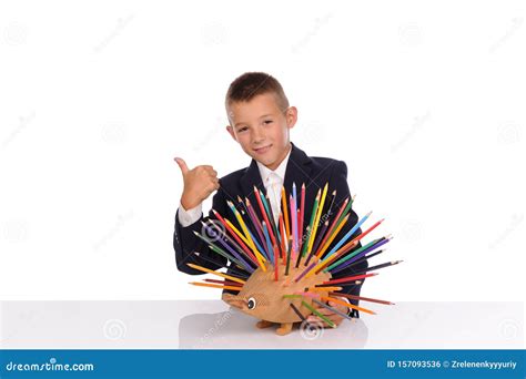 Schoolboy With Pencils Isolated On The White Background Stock Photo