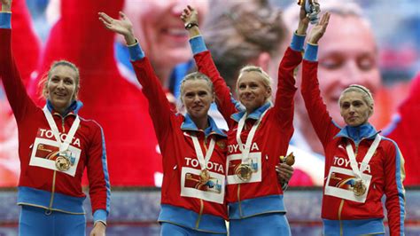 russian athletes kiss on podium in protest