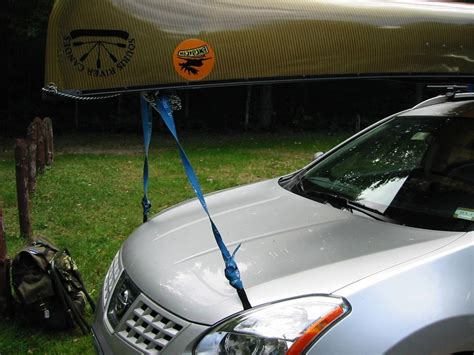 Open the doors of the car and pass the ratchet straps over to fix the front and the back of the kayak. BWCA Car Top: Straps or Rope? Boundary Waters Gear Forum