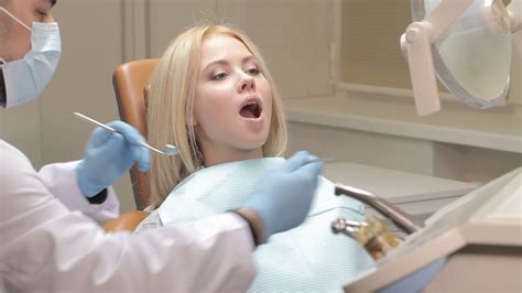 Dentist Checks Up Girls Teeth Stock Footage Sbv 306806105 Storyblocks